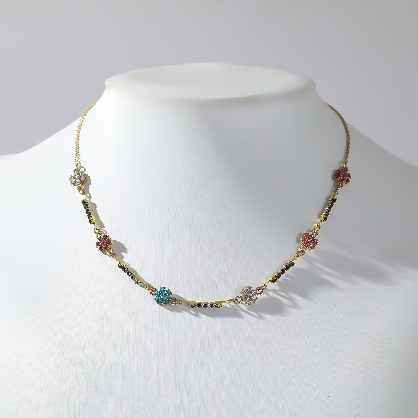 Gold Necklace with Multi-Colored Rhinestone Daisies and Black Rhinestone Accents