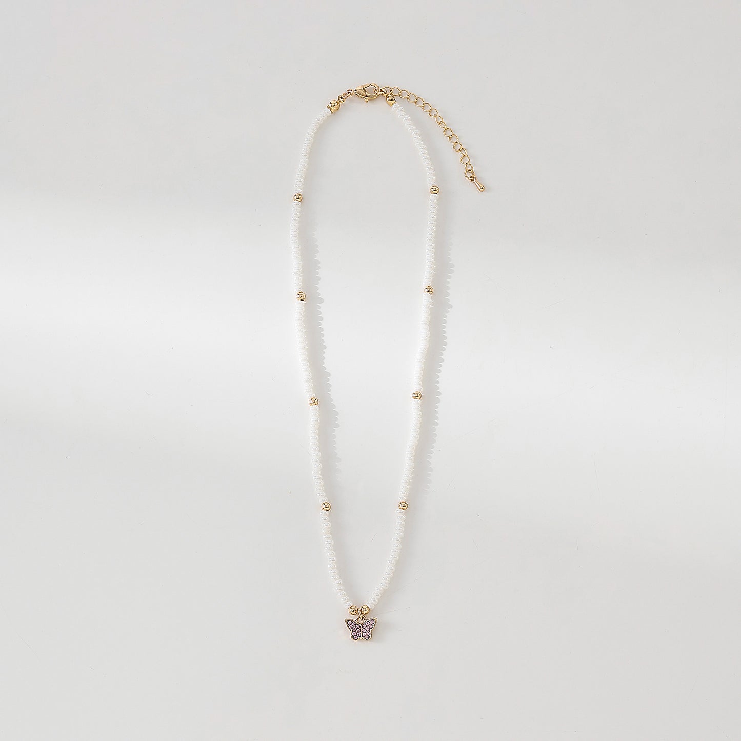Assorted crystal Butterfly golden charm with small pearls and golden bead Necklace