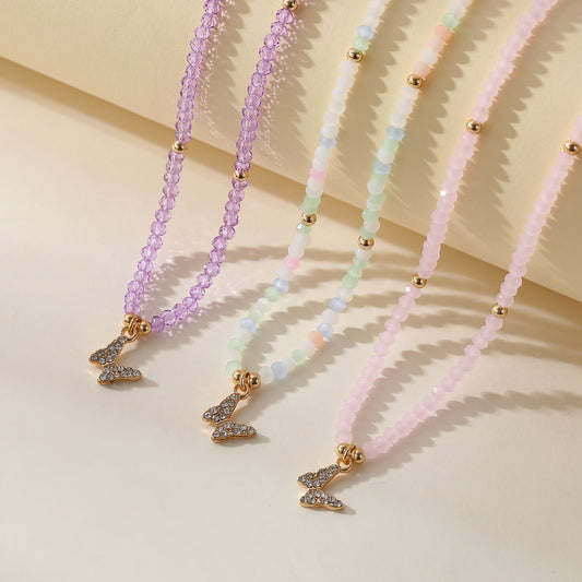 Assorted Pastel Beaded Necklace with Gold & Crystal Butterfly Charm - Elegant & Stylish Jewelry for Women