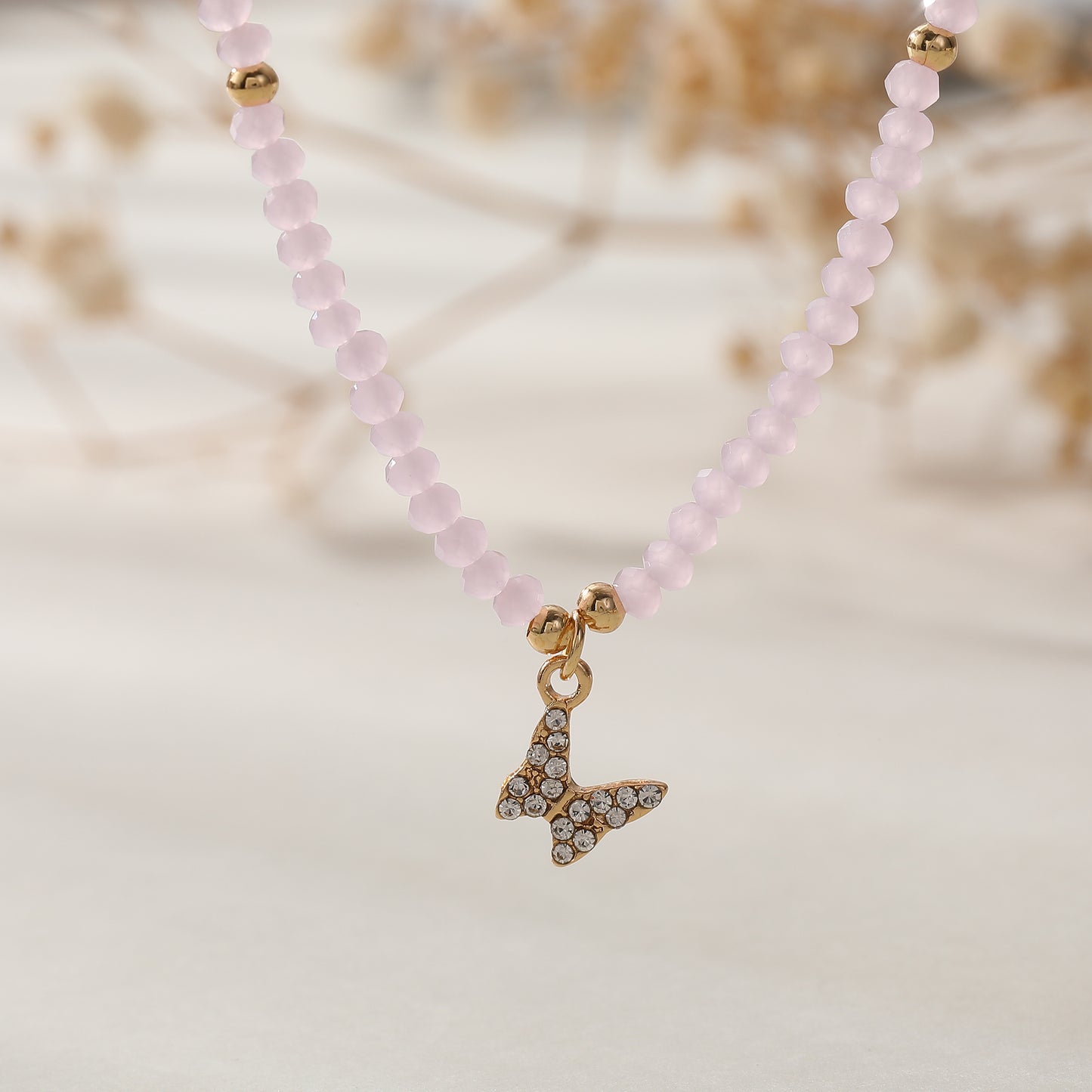 Assorted Pastel Beaded Necklace with Gold & Crystal Butterfly Charm - Elegant & Stylish Jewelry for Women