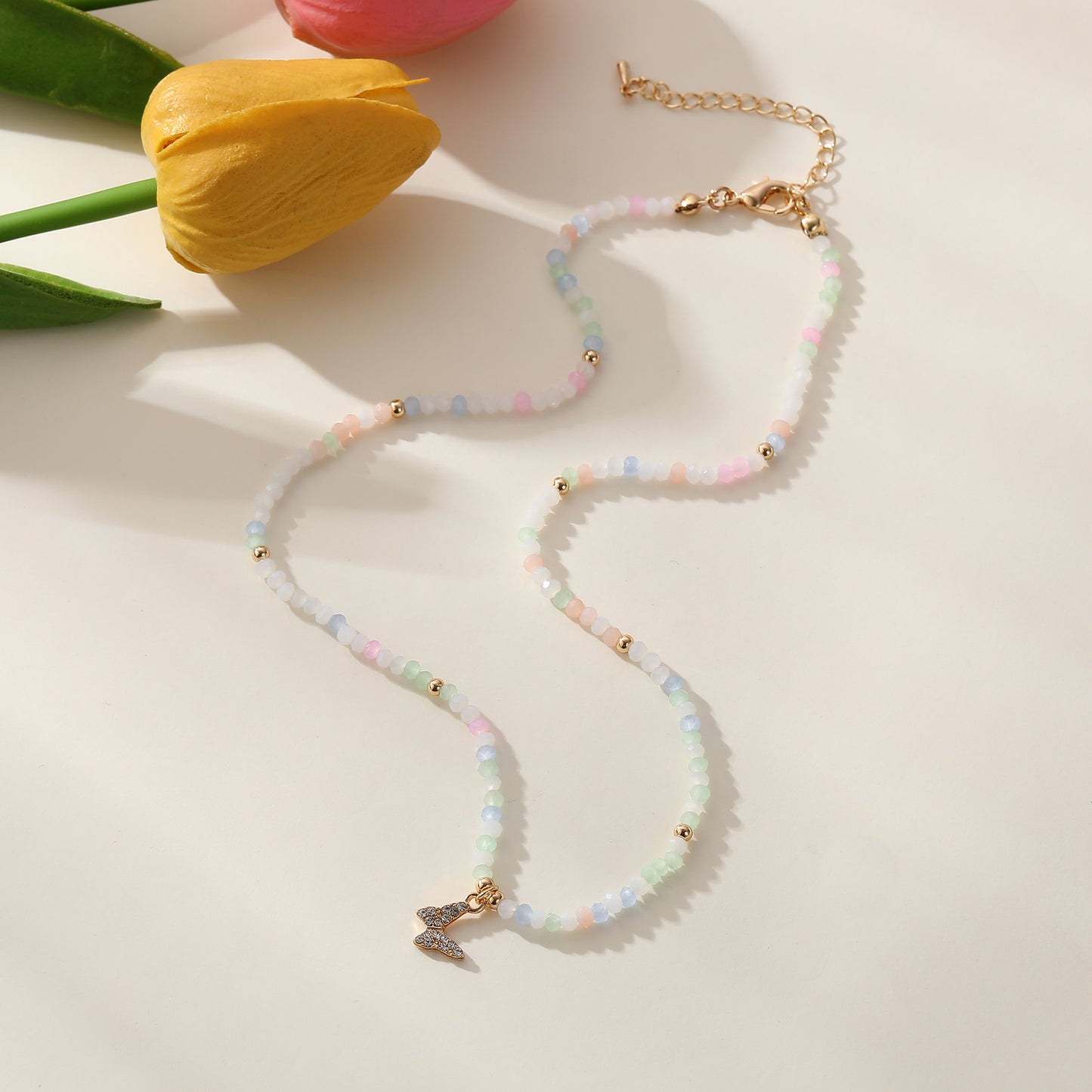 Assorted Pastel Beaded Necklace with Gold & Crystal Butterfly Charm - Elegant & Stylish Jewelry for Women