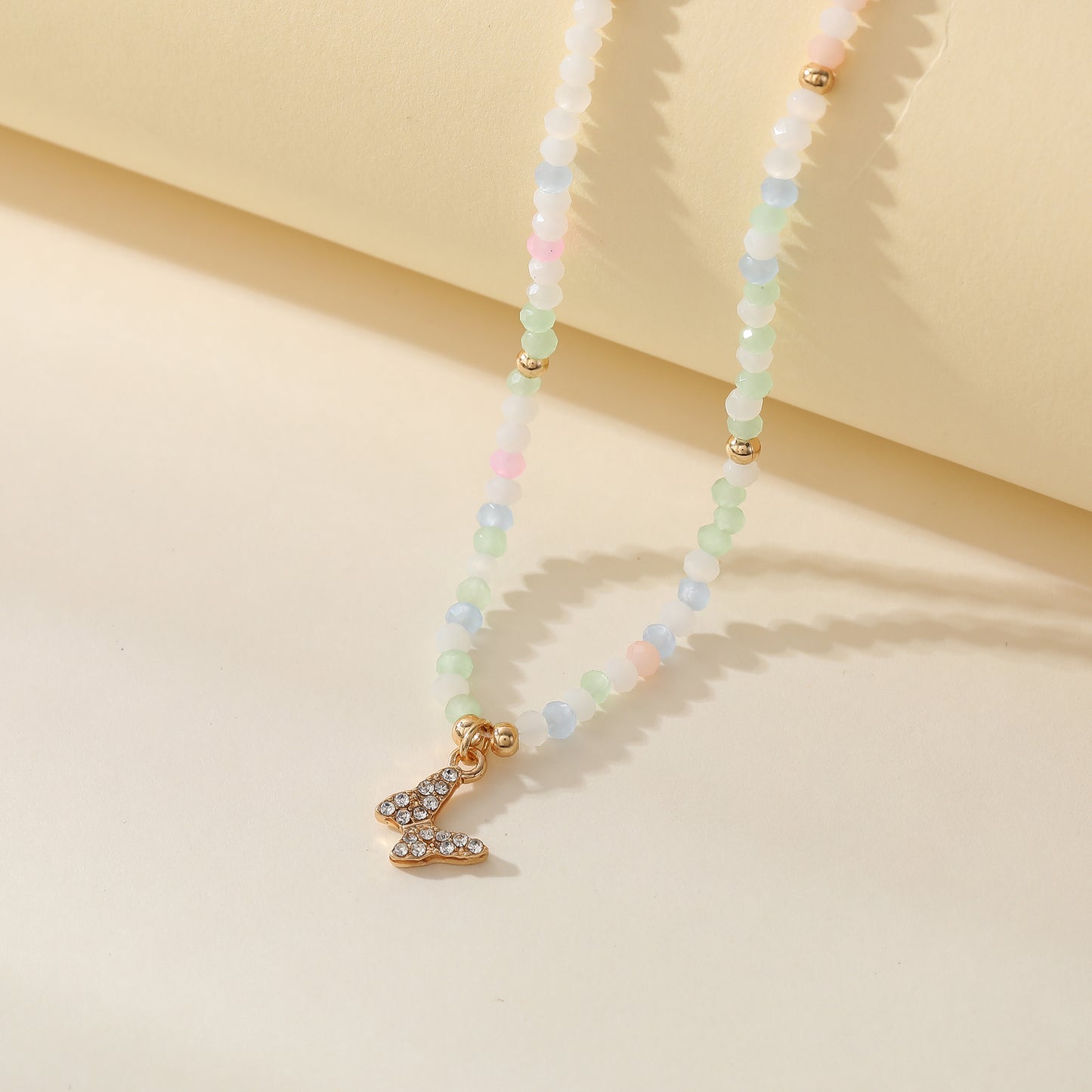 Assorted Pastel Beaded Necklace with Gold & Crystal Butterfly Charm - Elegant & Stylish Jewelry for Women