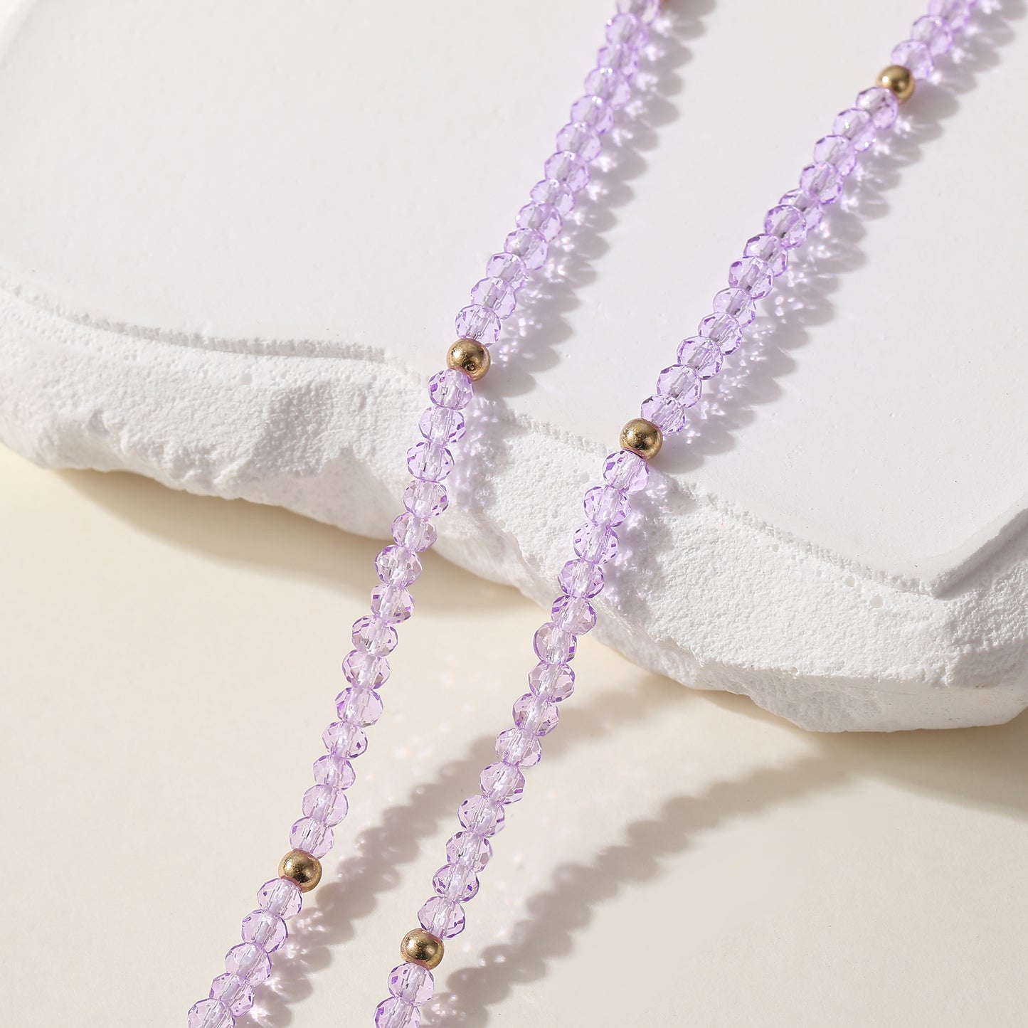 Elegant Beaded Necklace with Crystal & Gold Clover Charm - Stylish Jewelry for Women in Black, Purple, White & Pink