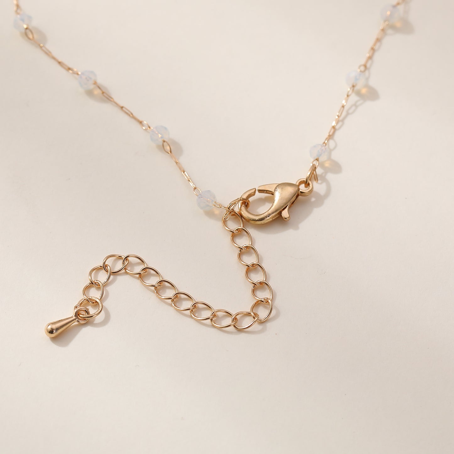 Delicate Gold Chain Necklace with Gold Cross & Assorted Faceted Beads - Elegant & Versatile Jewelry for Women
